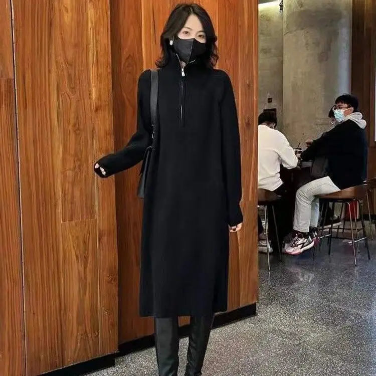 Loose-fitting knit dress above the knee.