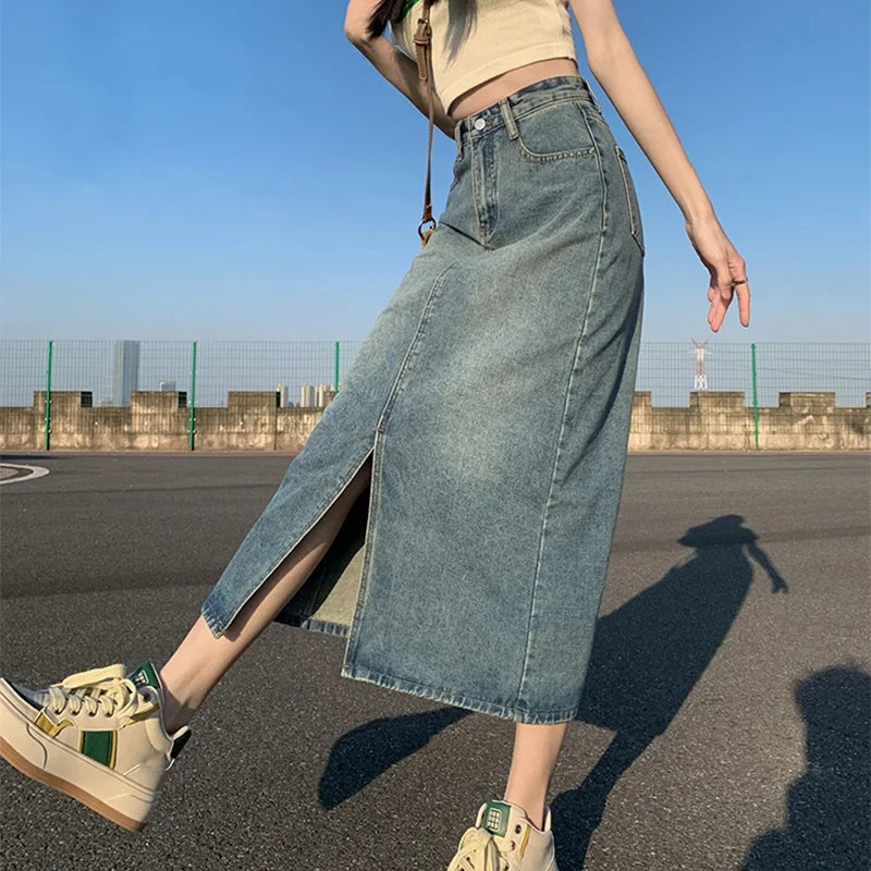 Women's high-waisted denim skirt with a slit, retro washed style.