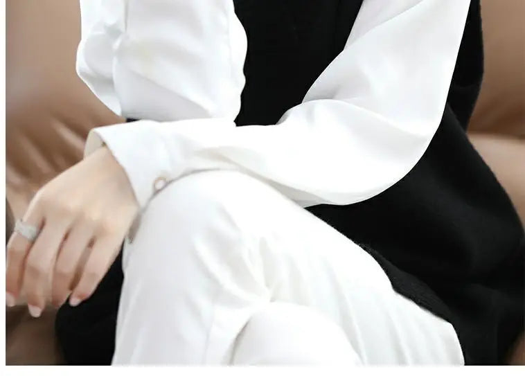 Navy blue plus size vest, medium to long length, in knit fabric.