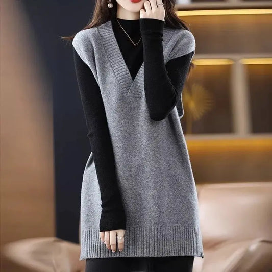 Navy blue plus size vest, medium to long length, in knit fabric.