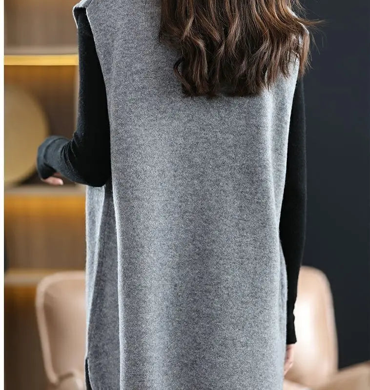 Navy blue plus size vest, medium to long length, in knit fabric.