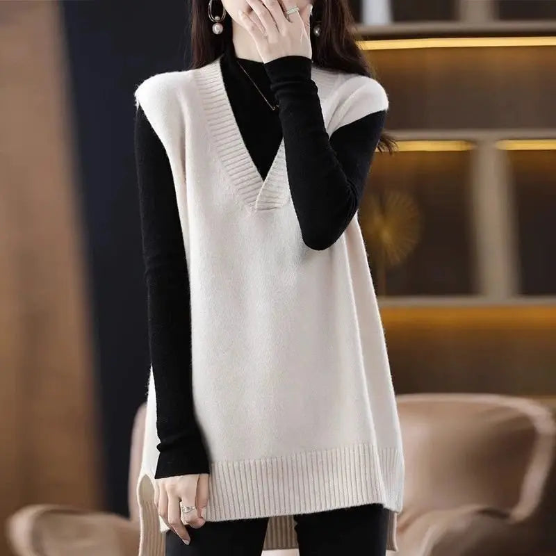 Navy blue plus size vest, medium to long length, in knit fabric.