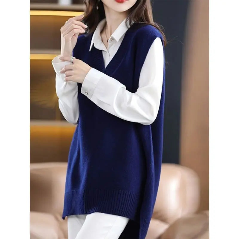 Navy blue plus size vest, medium to long length, in knit fabric.