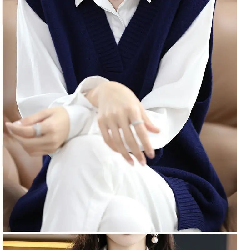 Navy blue plus size vest, medium to long length, in knit fabric.