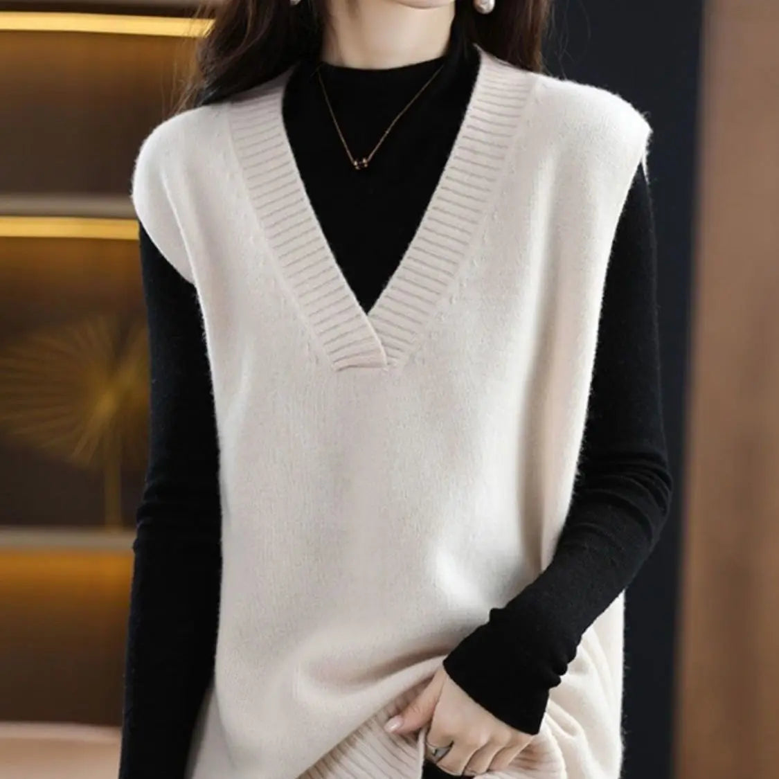 Navy blue plus size vest, medium to long length, in knit fabric.