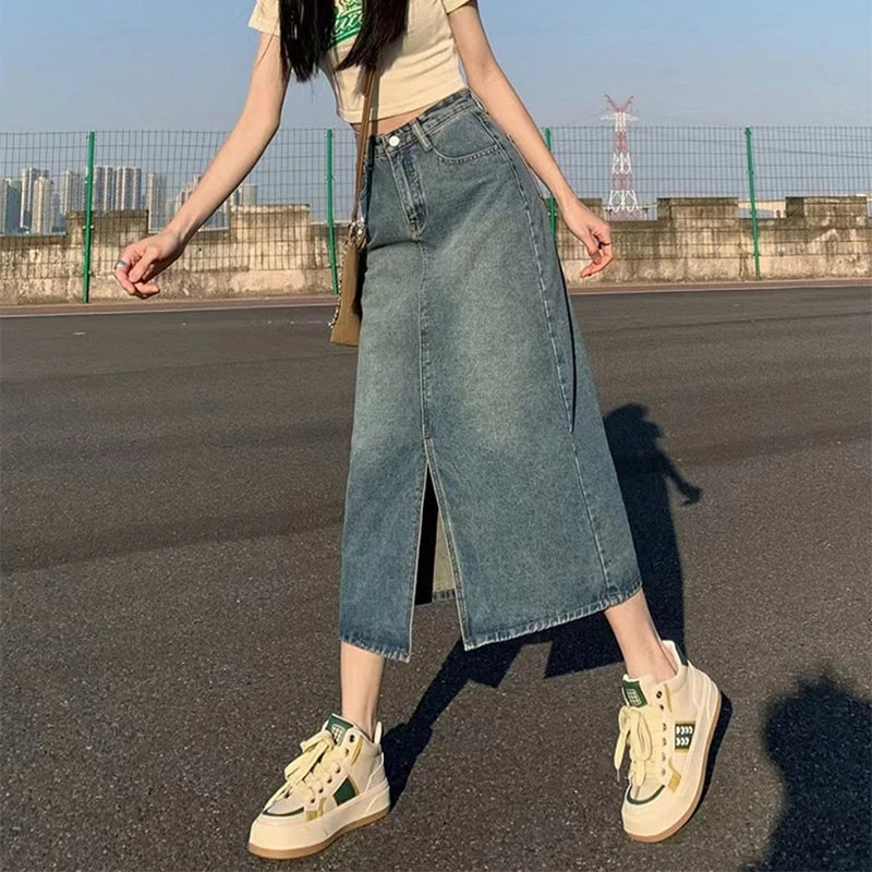 Women's high-waisted denim skirt with a slit, retro washed style.