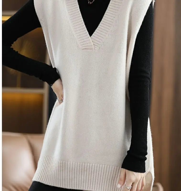 Navy blue plus size vest, medium to long length, in knit fabric.