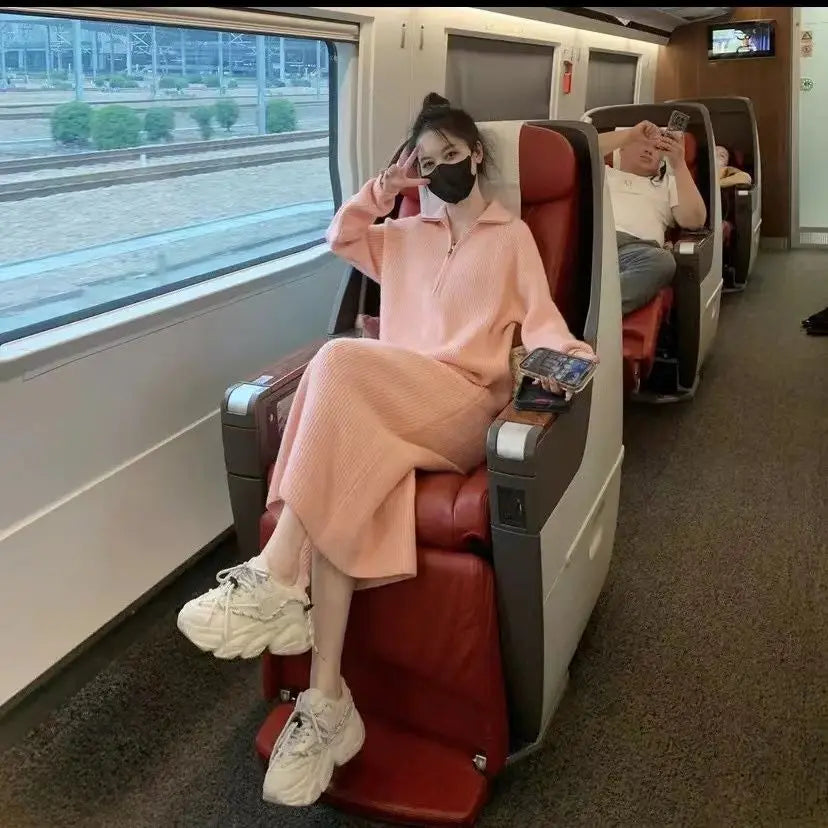 Loose-fitting knit dress above the knee.