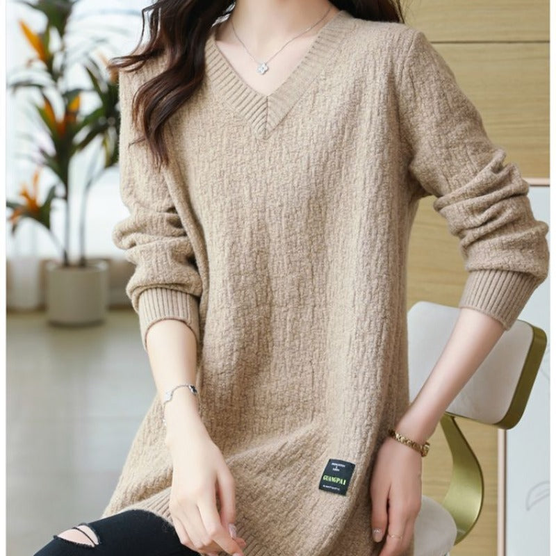 Women's knit sweater with V-neck, mid-length.
