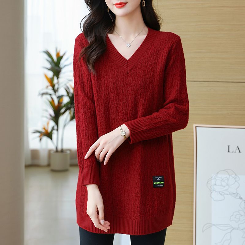 Women's knit sweater with V-neck, mid-length.